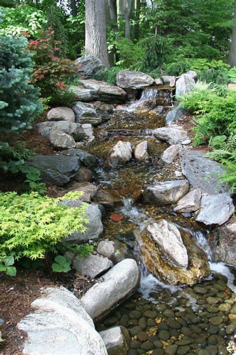 Today, i wanted to give you a peek of that first project! Pondless Waterfall | Rocks, Flats and Backyards