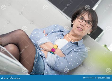 Brunette Mature Woman Relaxing In The Sofa Stock Image Image Of
