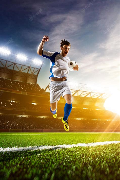 Premium Photo Soccer Player In Action On Sunset Stadium Background