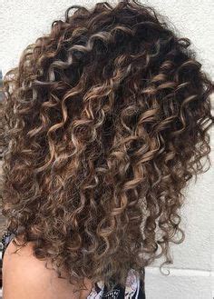 Beach blonde highlights are sprinkled lightly throughout the top portion of the hair in this easy hairstyle. Image result for long curly fun hair highlights and ...