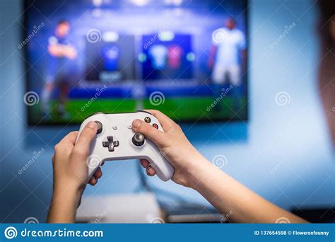 Video Gaming And Game Play On Tv Fun Gamer Holding Game Pad And