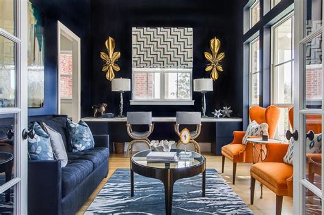 Gray spindle accent chairs with navy blue greek key pillows styled in a living room along with a charcoal gray sofa, a white balustrade coffee table and a modern fireplace with marble tiles. Living Rooms Navy Blue Accent Color - Design, decor, photos, pictures, ideas, inspiration, paint ...