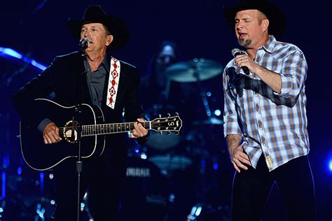 garth brooks and george strait perform together during 2013 acm awards highlight