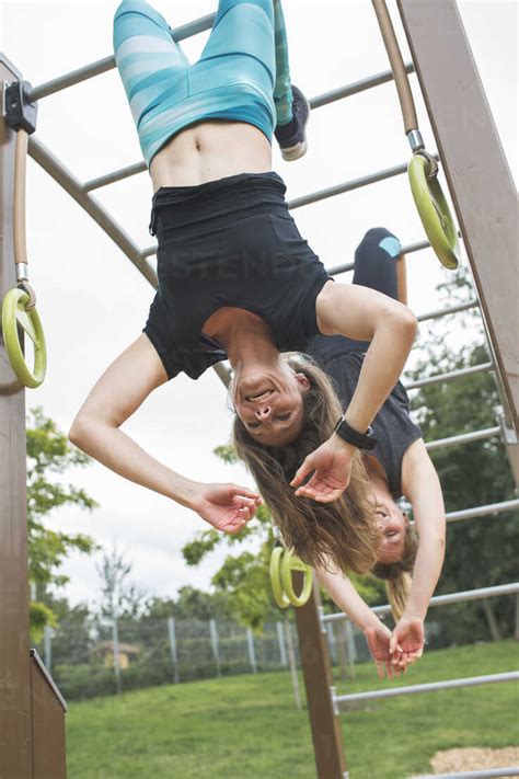 Two Women Having Fun Hanging In Jungle Gym Madf Matthias