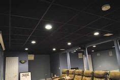 We are debating whether to take off the drop ceiling tiles. I love the gray walls and black drop ceiling. Can't wait ...