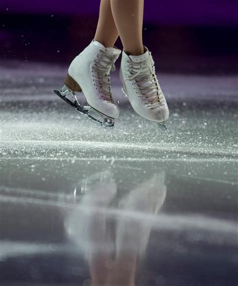 Ice Flies Away From The Skates Of Mao Asada Of Japan As She Performs