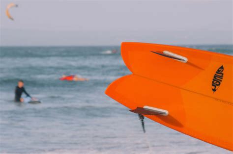 Person Close Up Photo Of Orange Surfboard Human Image Free Photo