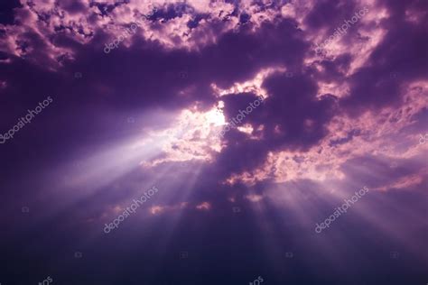 Rays Of Light Shining Through Dark Clouds Stock Photo By ©deerphoto