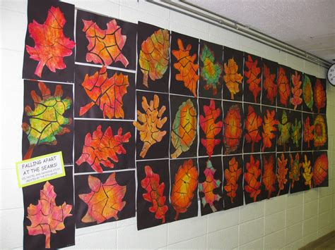 A Wall Covered In Lots Of Different Colored Leaves