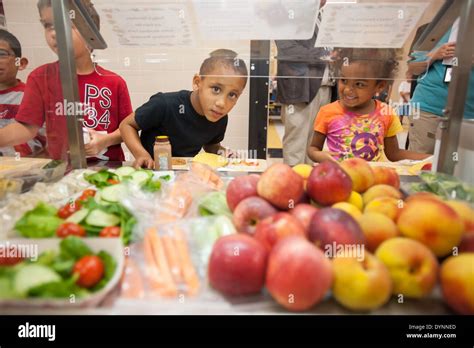 Elementary School Children Choosing Healthy Foods At School Cafeteria