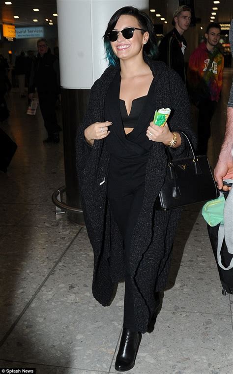 Demi Lovato Flashes A Hint Of Cleavage In Sexy Bra Top As She Jets In To The Uk Daily Mail Online