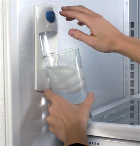 Can you hear the pump running when you press the paddle with the glass? GE Profile™ 22.2 Cu. Ft. Stainless Bottom-Freezer ...