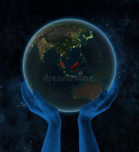 Malaysia On Night Earth In Hands In Space Stock Illustration
