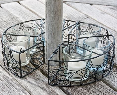These gorgeous candle holders are available in a wide array of colours, styles and designs so that you can create a soft glow in your home while making a style statement. Black Star Umbrella Stand 6 Votive Candle Holder 2.5" H x ...