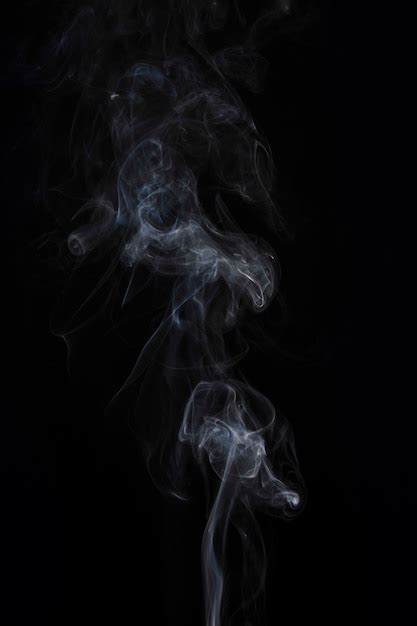 Movement Of White Smoke On Black Background Free Photo