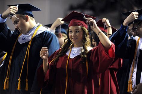 Sand Creek High School Graduates Turn Their Tassels During A Commencement Ceremony May 24 At