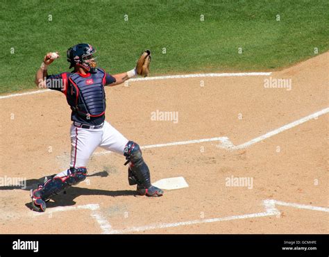 The Catcher Throwing The Ball At A Baseball Game Stock Photo Alamy