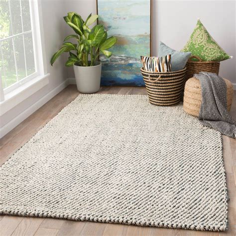 Our 9×12 area rug looked more like a wall to wall carpet, covering nearly every inch of our floor. Almand Natural Solid White & Gray Area Rug design by Jaipur. 100% just. 8x10, sale $483. | Area ...