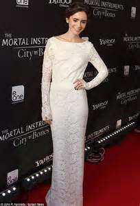 Lily Collins Displays Her Bare Back In A Revealing Lace Adorned Gown As