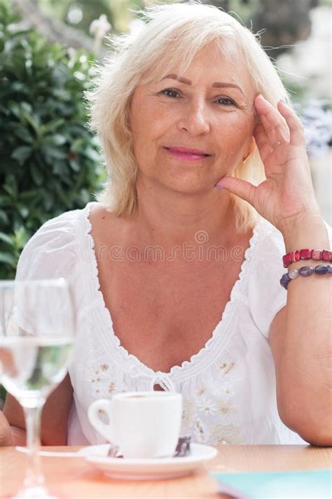 Smiling Mature Woman Drinking Coffee In The Cafe Folder And Ph Stock Image Image Of Drinking