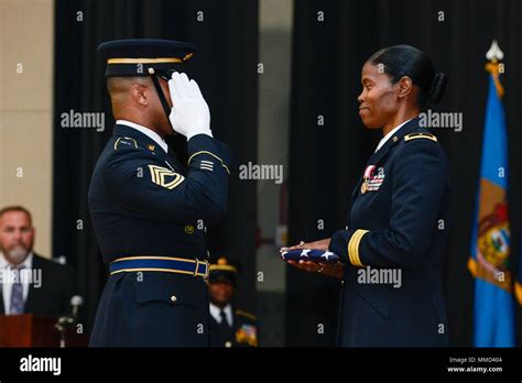 Us Army Brig Gen Barbara Owens Receives The American Flag And A