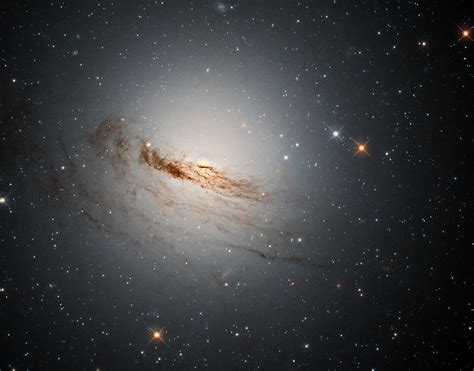 Faint Remnant Threads Hubble Captures An Unusual Lenticular Galaxy