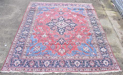 Lot 152 A Persian Design Rug With Central Red Ground