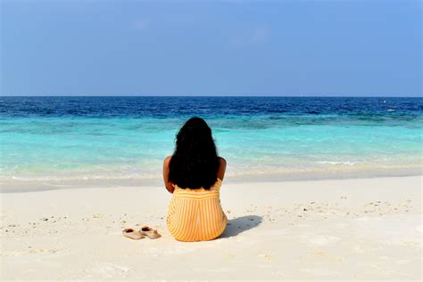 girl sitting on the beach pixahive