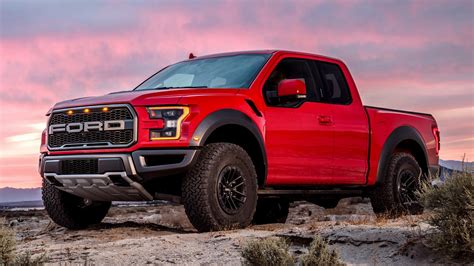 Red Ford F 150 Raptor Pickup Car With Pink And Purple Sky Backgrround