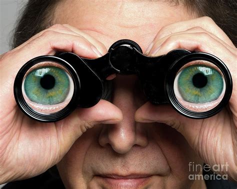 Man Holding Binoculars With Eyes On Lenses Photograph By Victor De