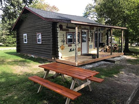 Take a stroll across the gravel drive to the lake and watch the sunset. Cabin Rentals on Brevort Lake | Black Point Resort