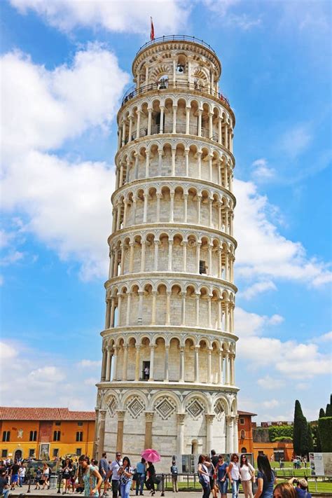 Tourists Posing In Front Of The Leaning Pisa Tower In Italy One Of