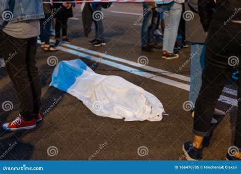 Human Body Covered By A Sheet Lying On The Street Stock Image Image Of Tarmac Victim 166476985