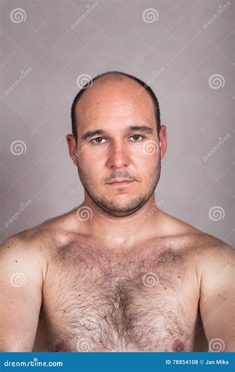 Serious Shirtless Muscular Man Posing In Gym Stock Photo