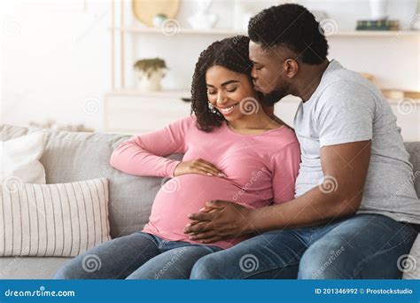 Black Man Kissing His Happy Pregnant Wife Stock Photo Image Of Belly Happy