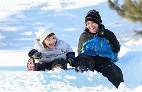 Children In Snow During Winter Stock Photo Image Of Child Light