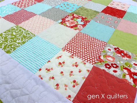 These free baby quilt patterns to download have tons of simple geometric shapes, so that your grandson will be snuggled up in style this year. {simple} patchwork baby quilt finish — AnneMarie Chany