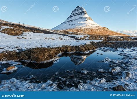 Reflection Of Kirkjufell Mountain Under Clear Sky During Winter Stock