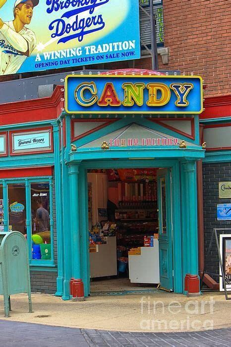 An Old Fashioned Candy Shop On The Corner Of A Street
