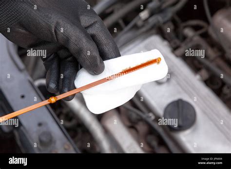 Checking Oil Level In The Car Engine Stock Photo Alamy