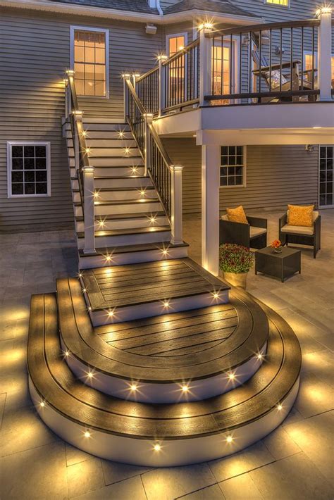Dark paint don't be afraid to make a bold statement with your staircase, like this one that's painted an inky gray. Stunning Stair Lighting Ideas That Will Steal The Show