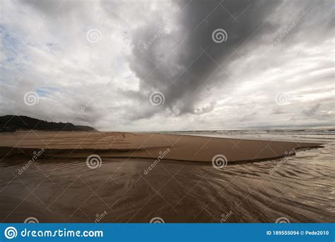 Dark Clouds Over The Sandy Beach Stock Photo Image Of Cloud Nature