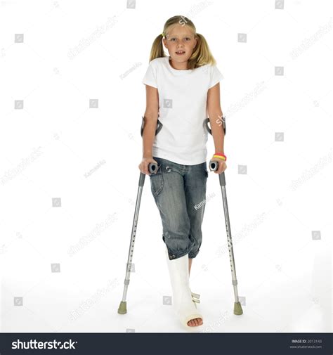 Girl With A Broken Leg Walking On Crutches Stock Photo 2013143