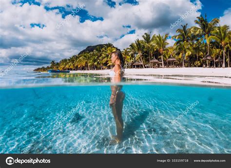 Woman Posing In Transparent Blue Ocean Swimming In Blue Water A Stock