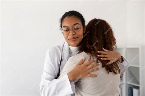 Free Photo Medium Shot Doctor Hugging Patient