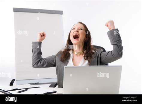 Cheering Business Woman With Clenched Fists Stock Photo Alamy