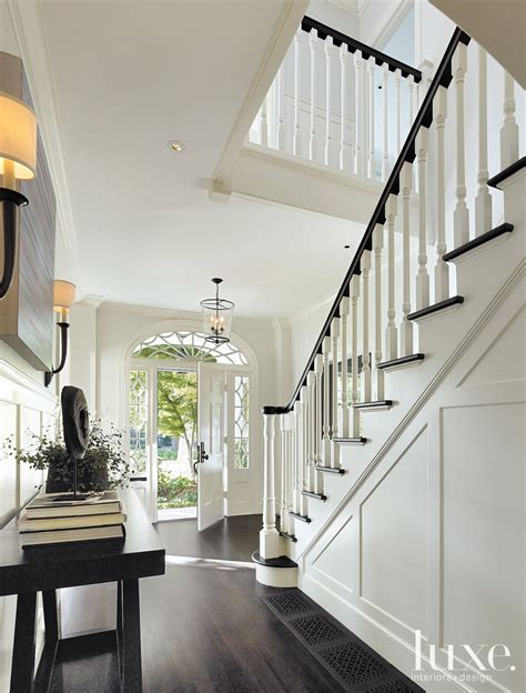 Traditional Black And White Staircase And Entry Colonial House