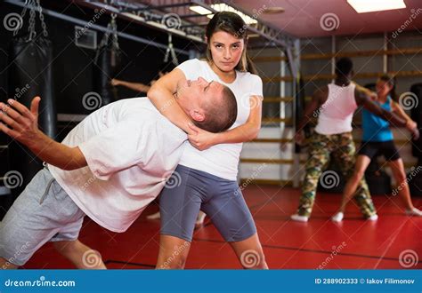 woman makes choke hold in self defense training stock image image of european french 288902333