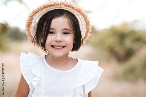 Smiling Kid Girl 3 4 Year Old Wearing Straw Hat And White Stylish Shirt