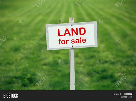 Land Sale Sign Against Trimmed Lawn Image And Photo Bigstock